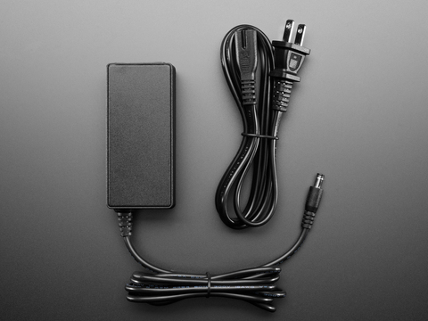 352 This is a 12V 5A AC/DC desktop power supply from Adafruit Industries LLC, providing 60W of power. It features an IEC 320-C8 input and a 2.1mm barrel plug output.