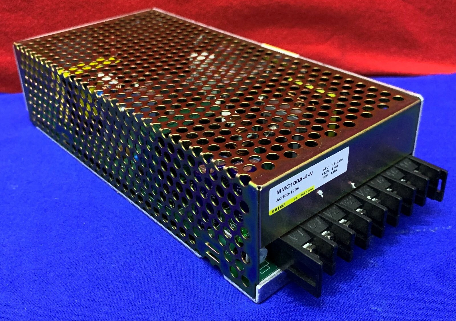 MMC100A-4-N The Cosel MMC100A-4-N is an enclosed AC/DC power supply with three outputs: +5V, +12V, and -12V. It offers 75% efficiency and chassis mounting.