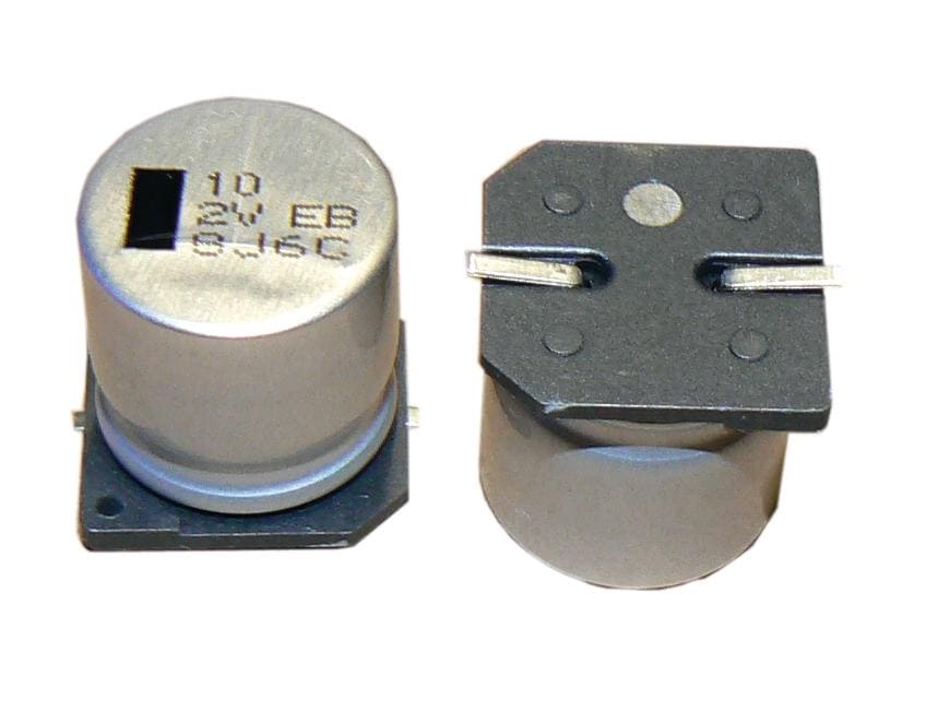 AEB107M2DS44T-F The Cornell Dubilier Electronics AEB107M2DS44T-F is a 100µF, 200VDC SMT Aluminum Electrolytic Capacitor. It features a ±20% tolerance and a rated life of 5000 hours.