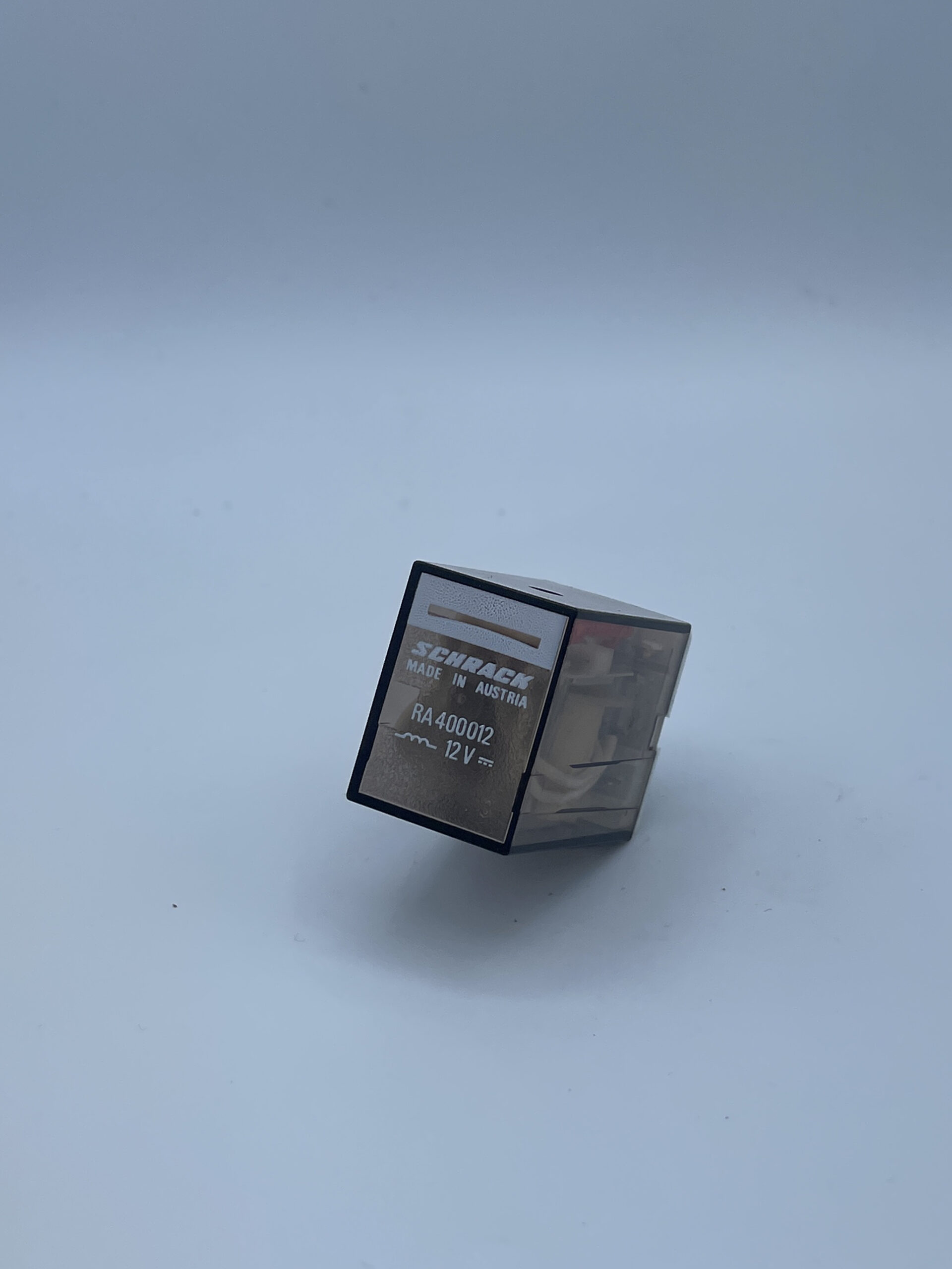 RA400012 The Schrack RA400012 is a 4-pole relay designed for plug-in mounting. It operates with a 12VDC coil and offers a contact rating of 5A at 250VAC.