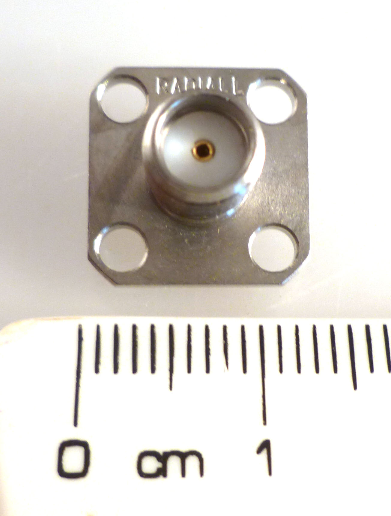 R125-614-011 The Radiall R125-614-011 is a female SMA bulkhead socket with a 50 Ohm impedance. It operates from 0 to 18GHz.