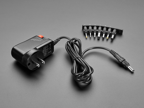 1448 This Adafruit 1448 is a compact switching AC/DC wall adapter with selectable output voltages from 3V to 12VDC, capable of delivering up to 1.5A. It features universal AC input for global use.