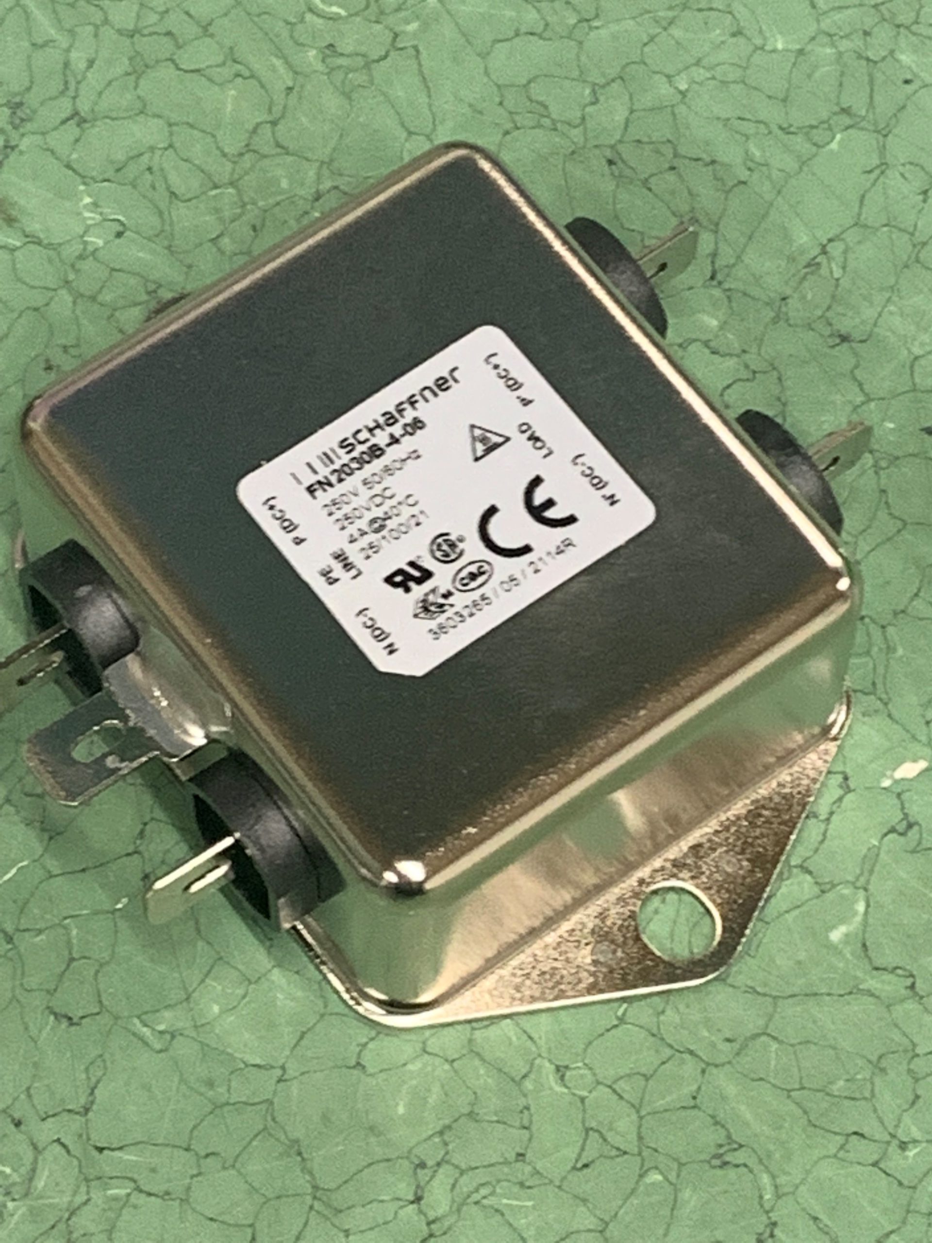 FN2040B-4-06 The Schaffner FN2040B-4-06 is a 1-phase single-stage power line filter designed for general purpose applications. It features a 4A current rating and a 250VAC voltage rating.